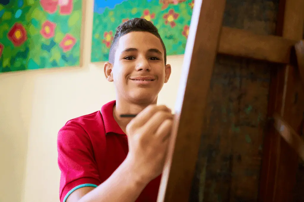 Teen paints a picture while discovering the many benefits of art therapy