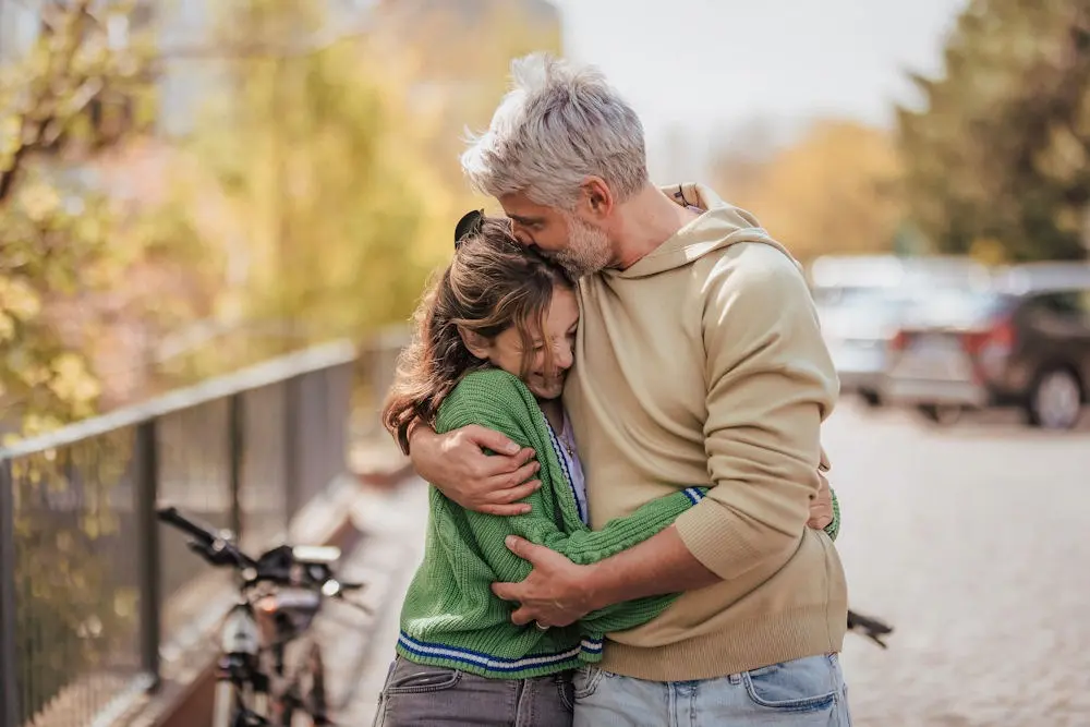 Teen and parent walking together in the North Shore after early mental health intervention.