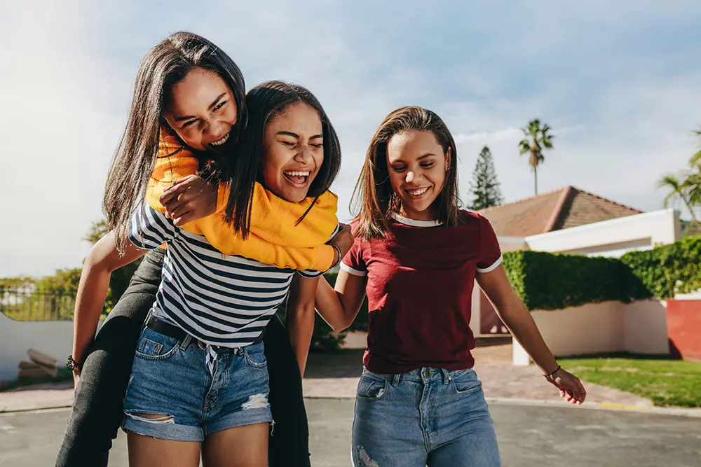 Group of teens connecting and building supportive friendships for mental wellness.