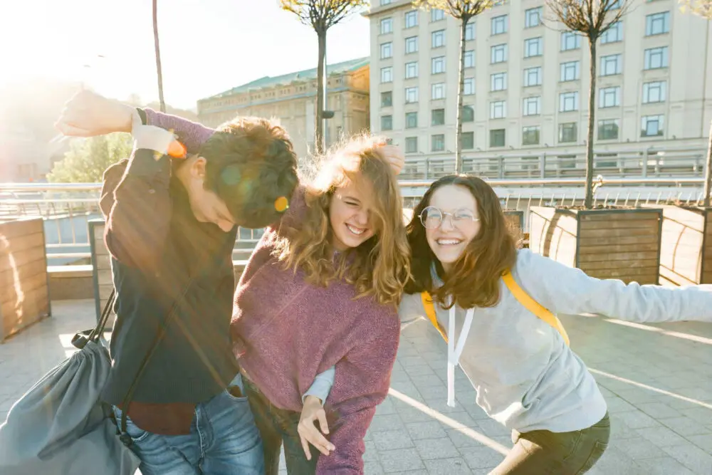 Teen building confidence through gradual social engagement and emotional resilience.