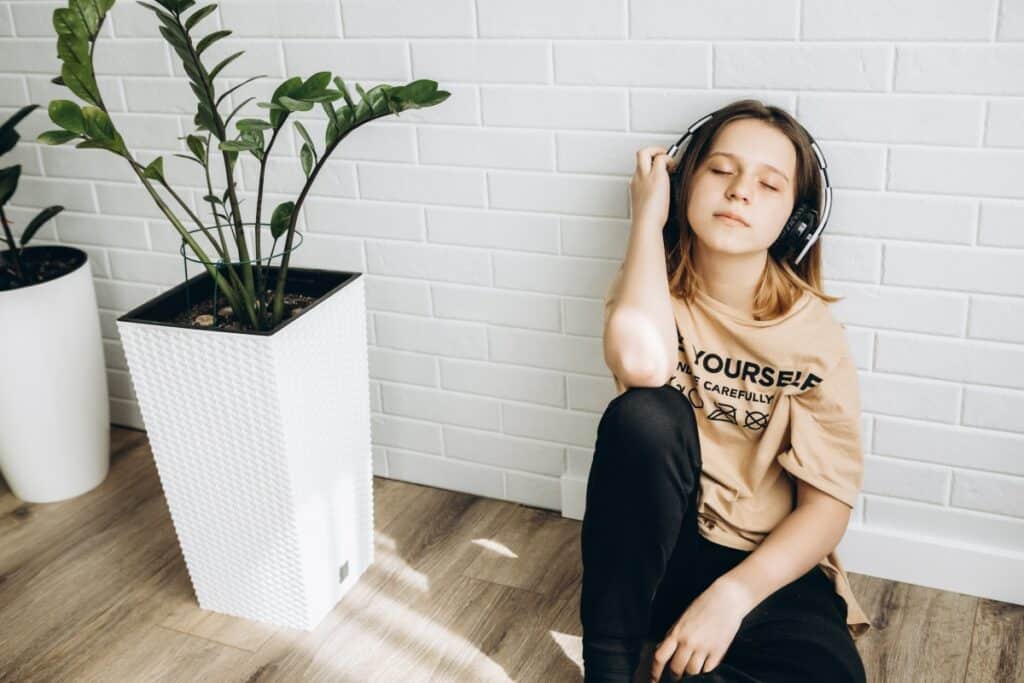 adolescent girl experiencing the benefits of music therapy