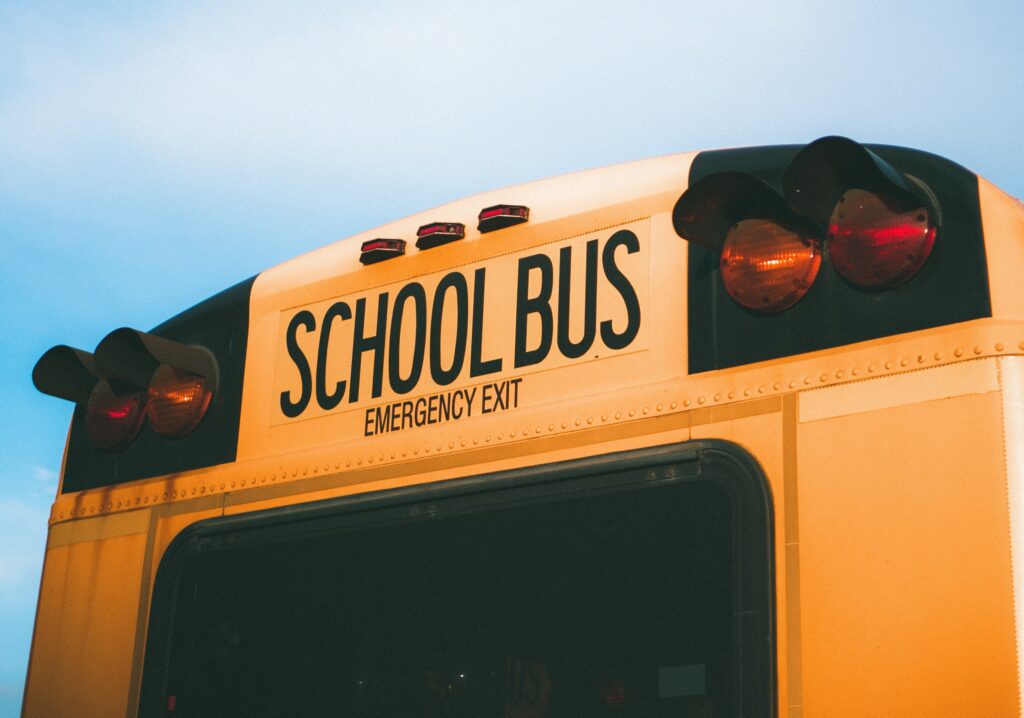 back of a yellow that an adolescent is riding because of school school refusal interventions