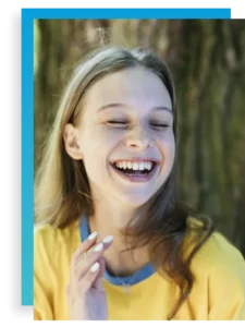 teen girl laughing in individual therapy