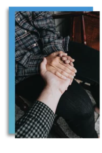 two people holding hands in mindfulness-based therapy
