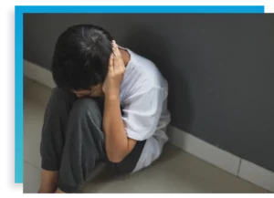 teen boy looking sad in an adolescent trauma treatment program