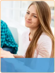 teen girl smiling at someone off-camera