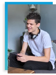 teen boy smiling in individual therapy