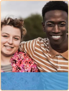 teen girl and teen boy pose for the camera