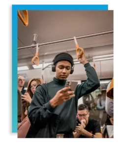 teen male on his phone in the subway thinking about teen electronic addiction
