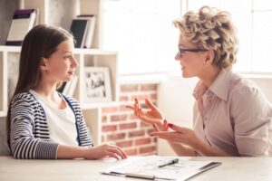 adolescent girl talking to therapist about OCD test for teens
