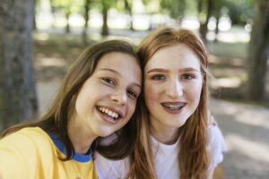 two teen girls in outdoor setting