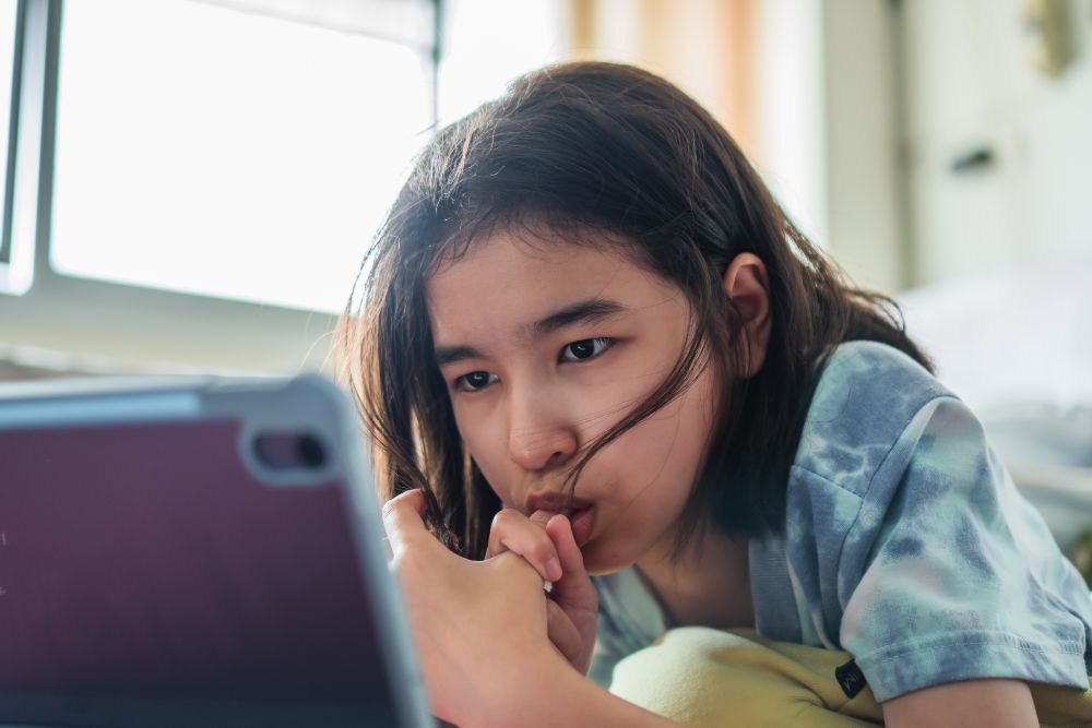 Asian girl using tablet for social media connections