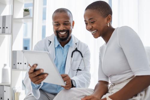 Doctor talks to teen about Optum insurance coverage