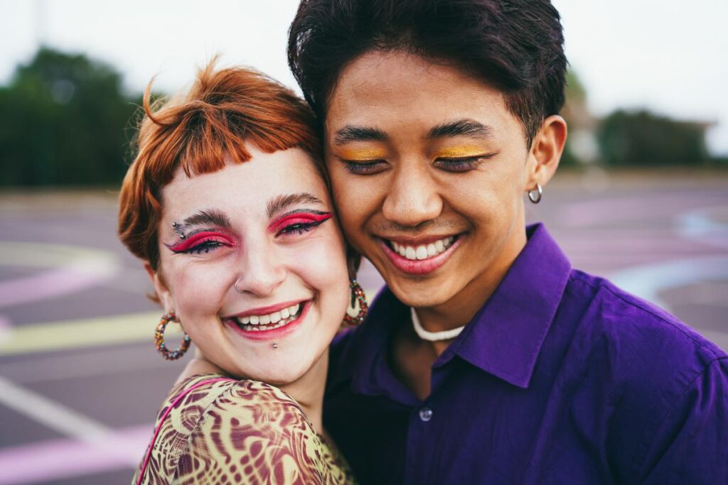 Two teens smile after talking about Massachusetts gender affirming care