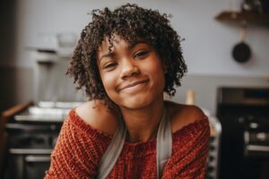 Woman who is living with smiling depression smiles at the camera