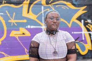 Woman stands in front of street art and wonders about the types of borderline personality disorder