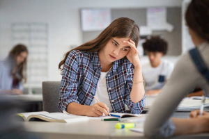 teen in school considers the signs of a thought disorder