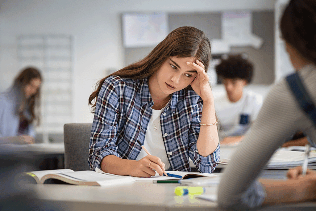 A teen in her school experiencing symptoms that require thought disorder treatment