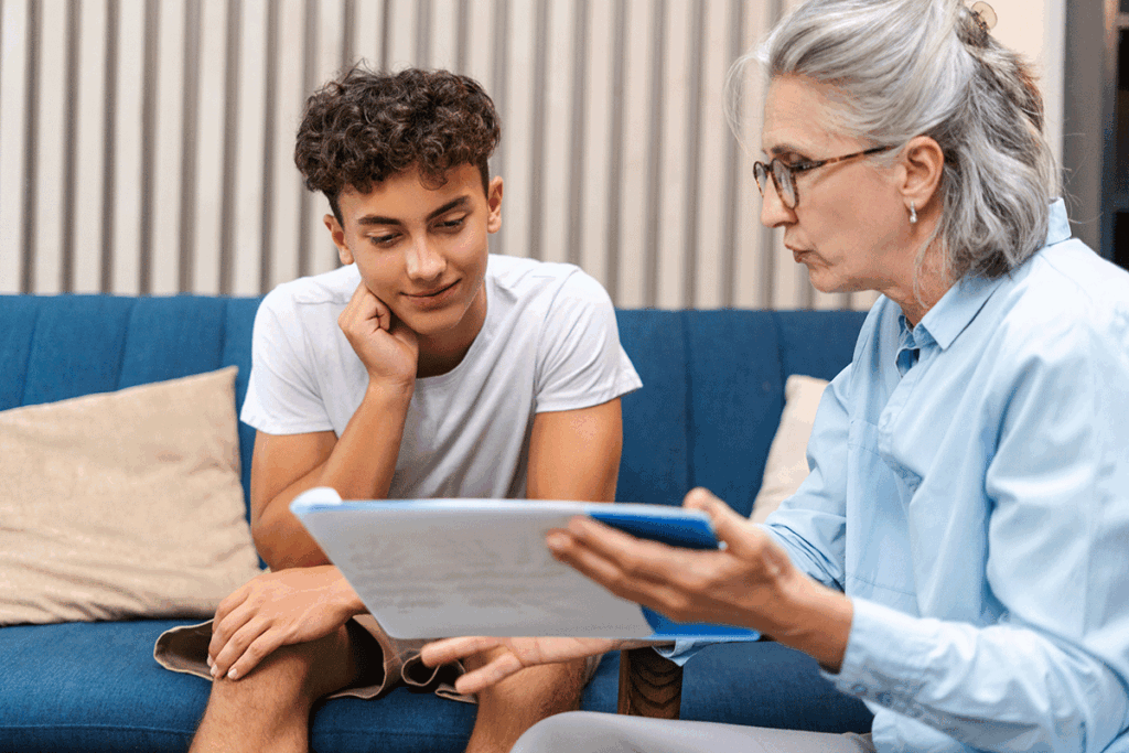 Therapist explaining to her patient the mental illness test for teenagers