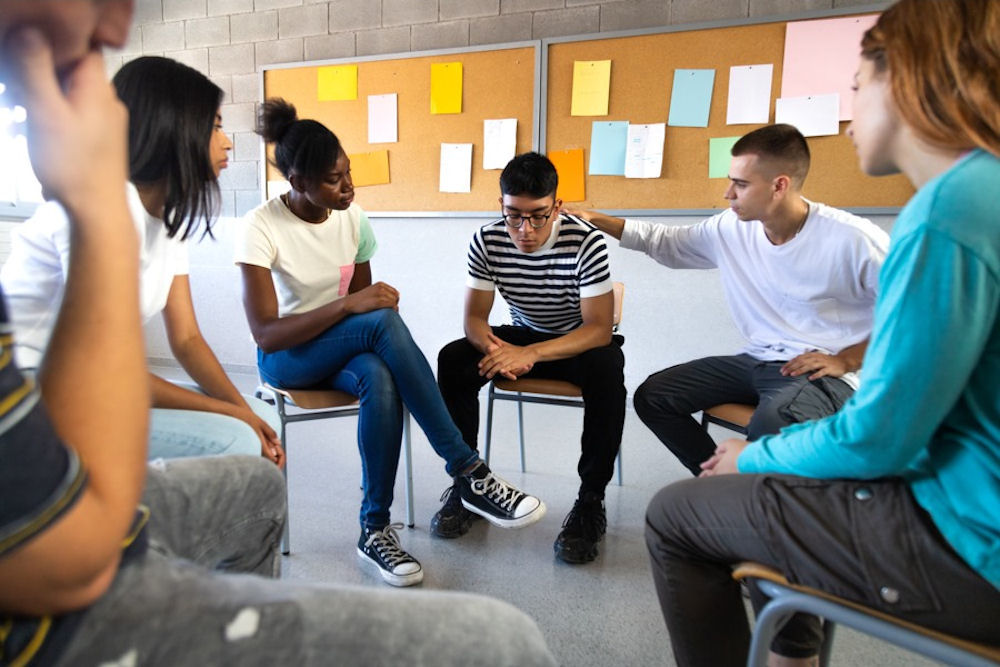 lgbtq+ teen in family therapy session during IOP or PHP treatment