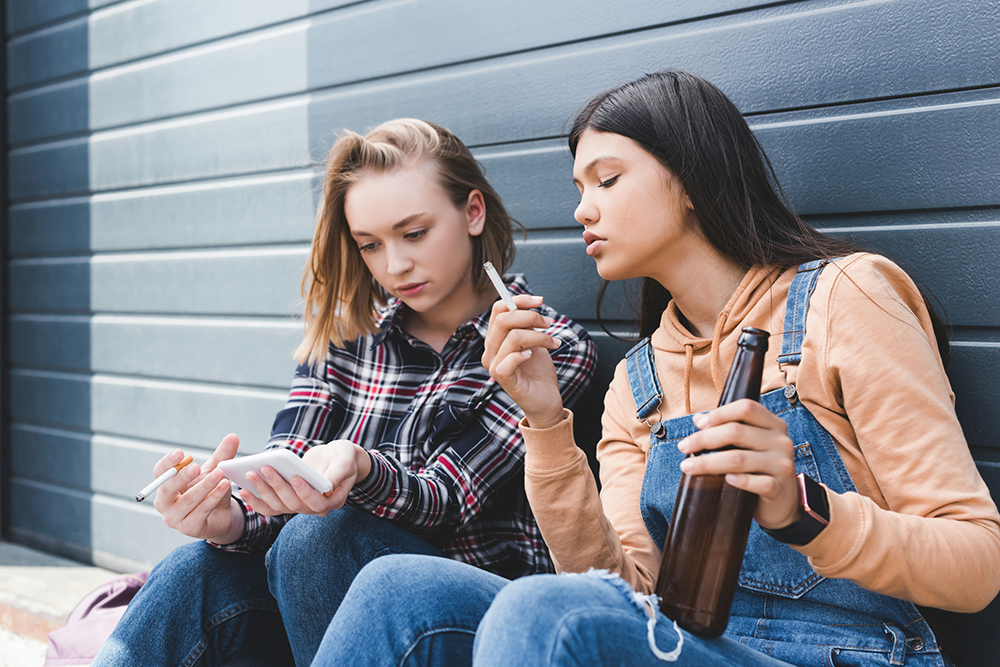 Teen struggling with substance use disorder, showing behavioral and emotional signs of addiction.