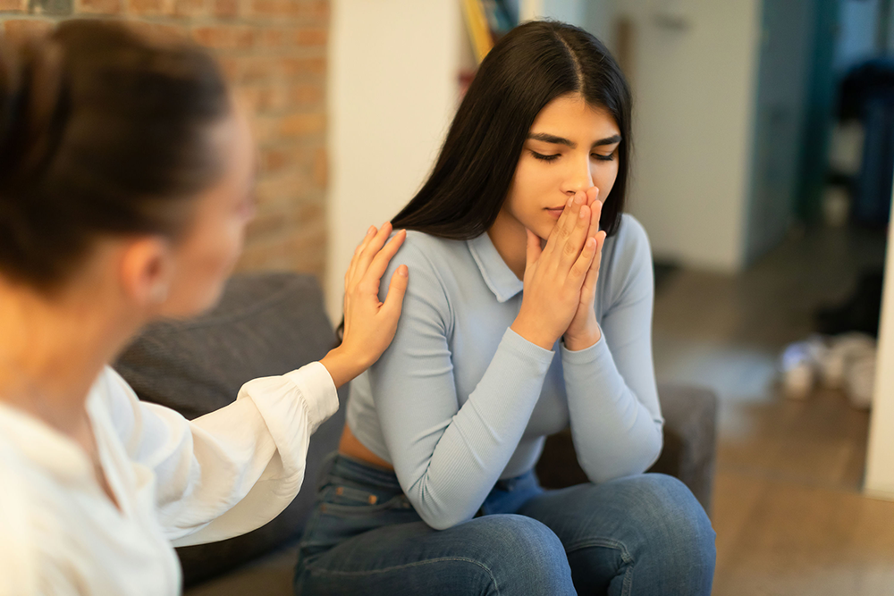 Mobile crisis intervention professional providing in-home support for a teen in crisis.