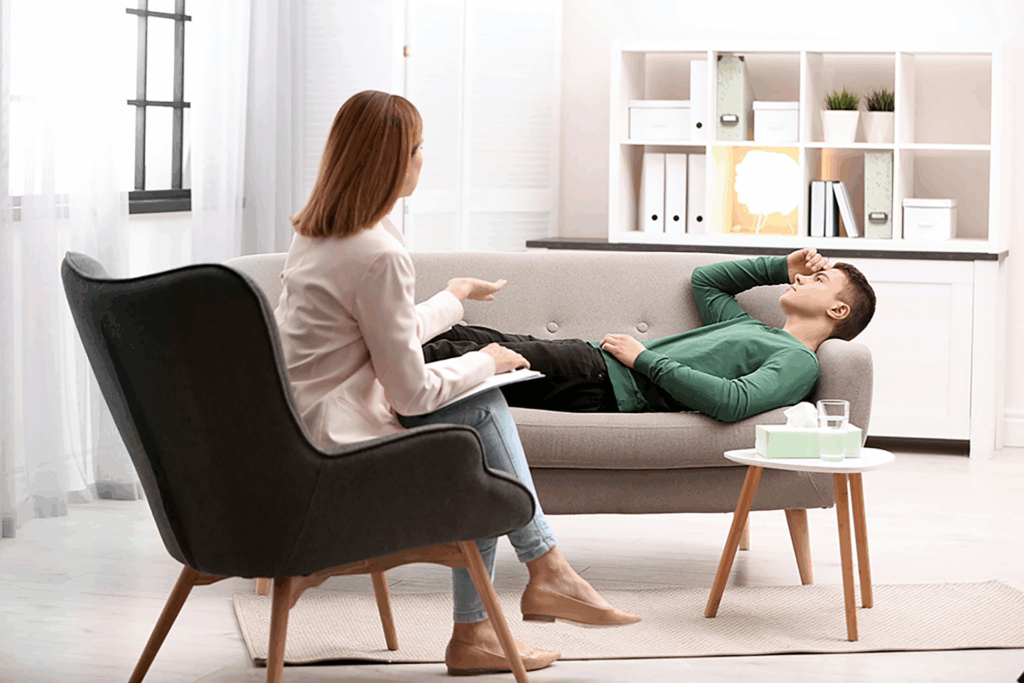 Mental health professional practicing crisis de-escalation with a teen in a supportive environment.