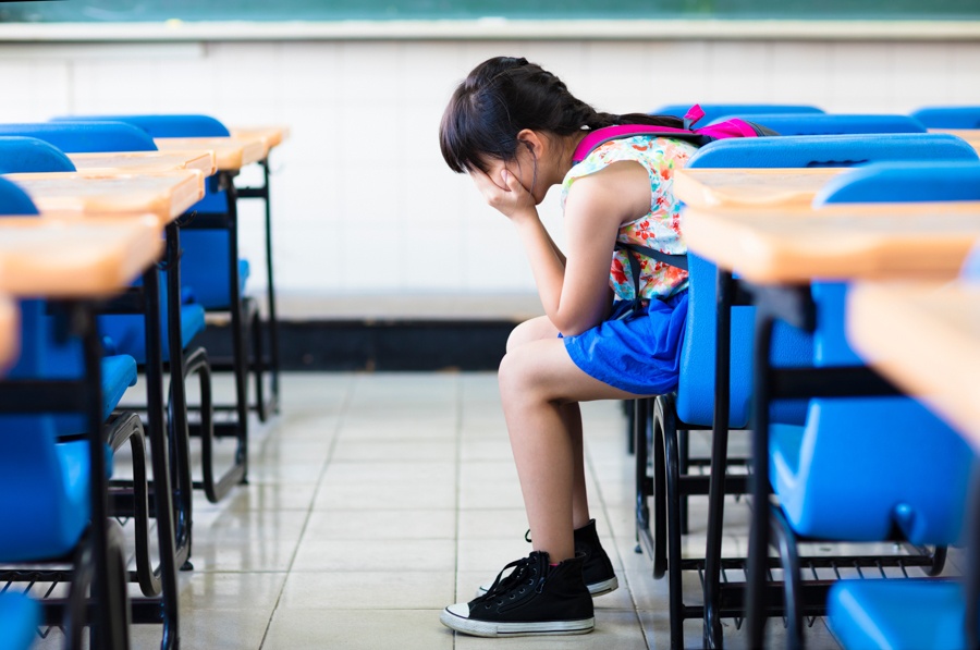 Child with disrupted sleep and school difficulties, highlighting daily challenges of PANDAS medical condition.