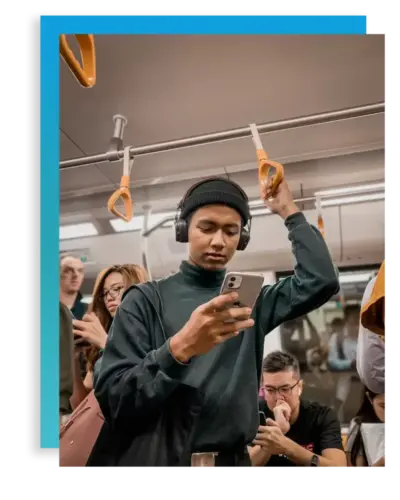 Young man on train struggling with technology addiction