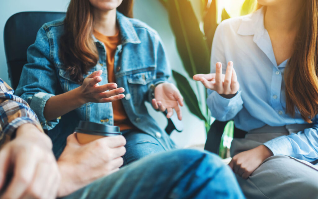 Teens participating in a peer support group as part of an alumni recovery program
