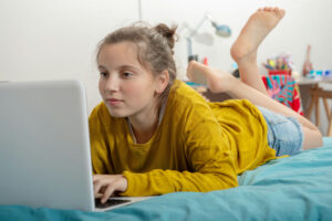 Teen showing signs of gaming addiction with prolonged screen use