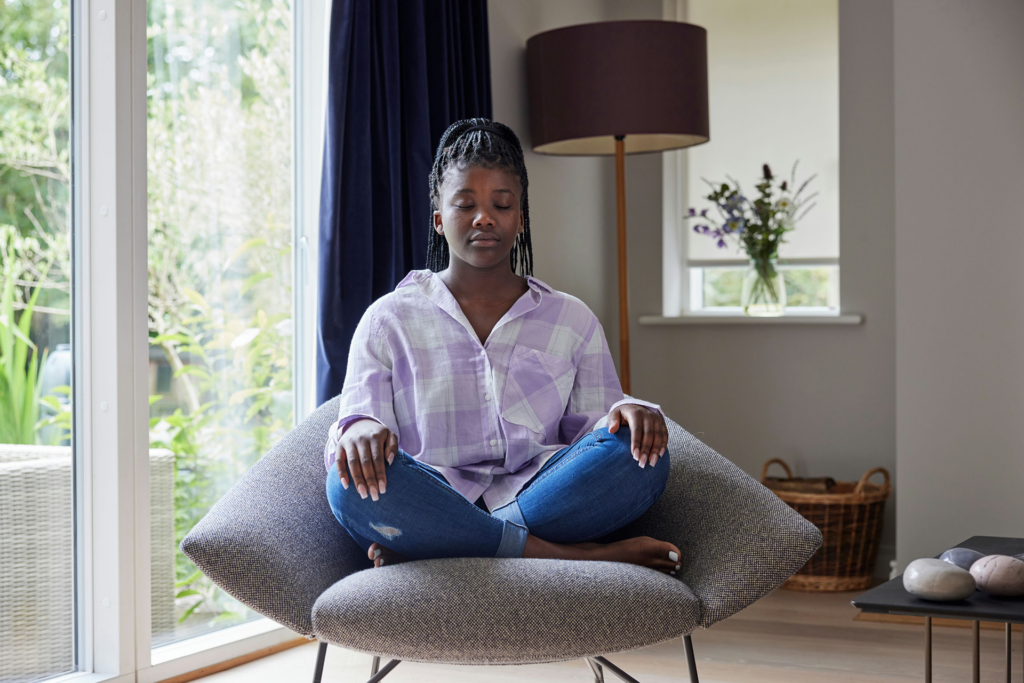Teen using mindfulness as an OCD strategy to manage intrusive thoughts without engaging in compulsions