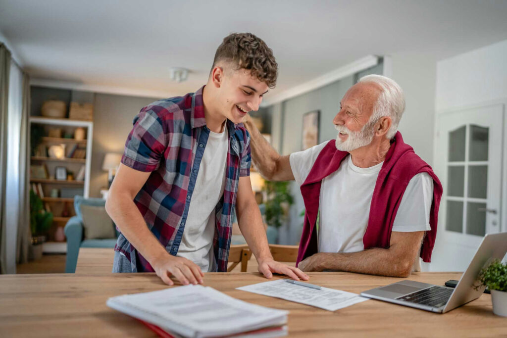 randparent helping teen organize homework planner while discussing ADHD symptoms