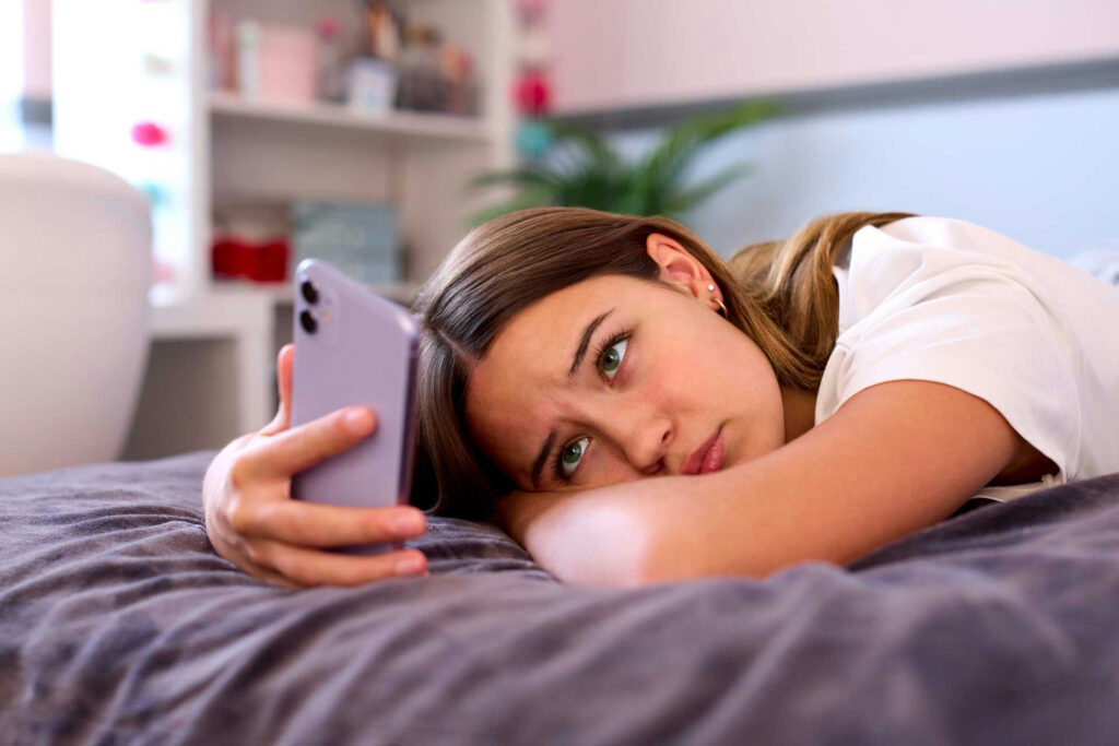 Teen interpreting text messages negatively, triggering emotional reaction