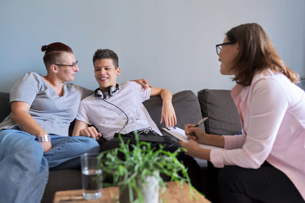 Family participating in ERP therapy planning for teen OCD treatment