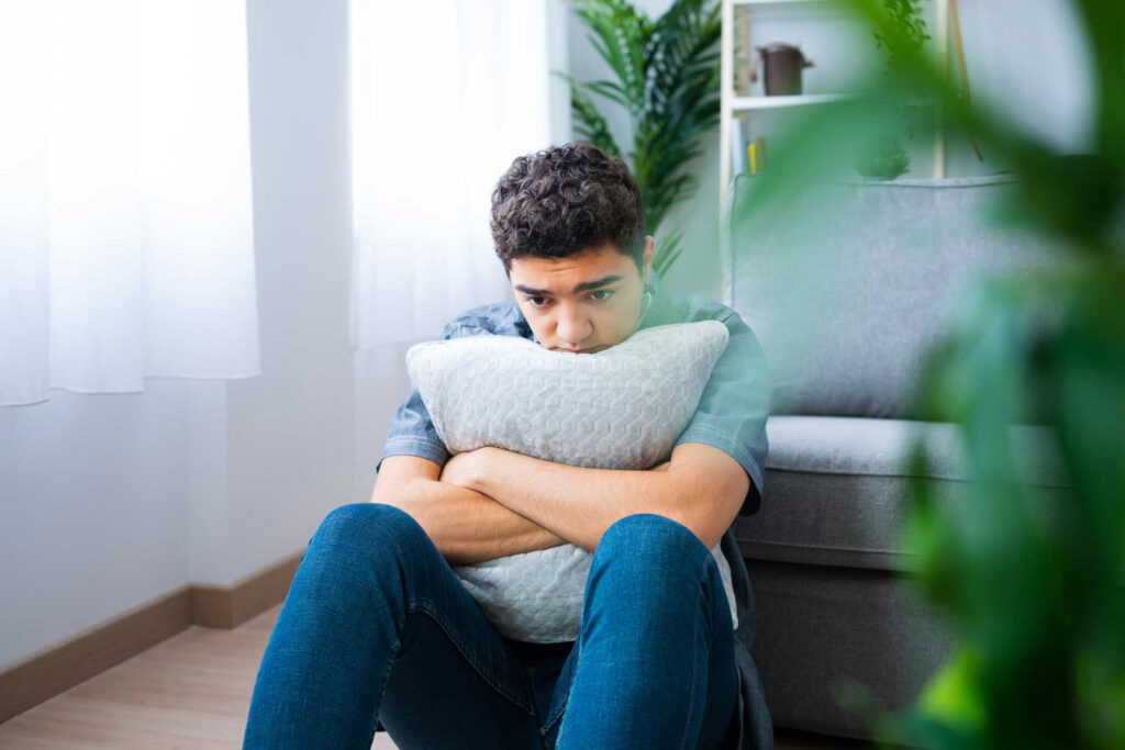 Teen coping with overwhelming emotions alone
