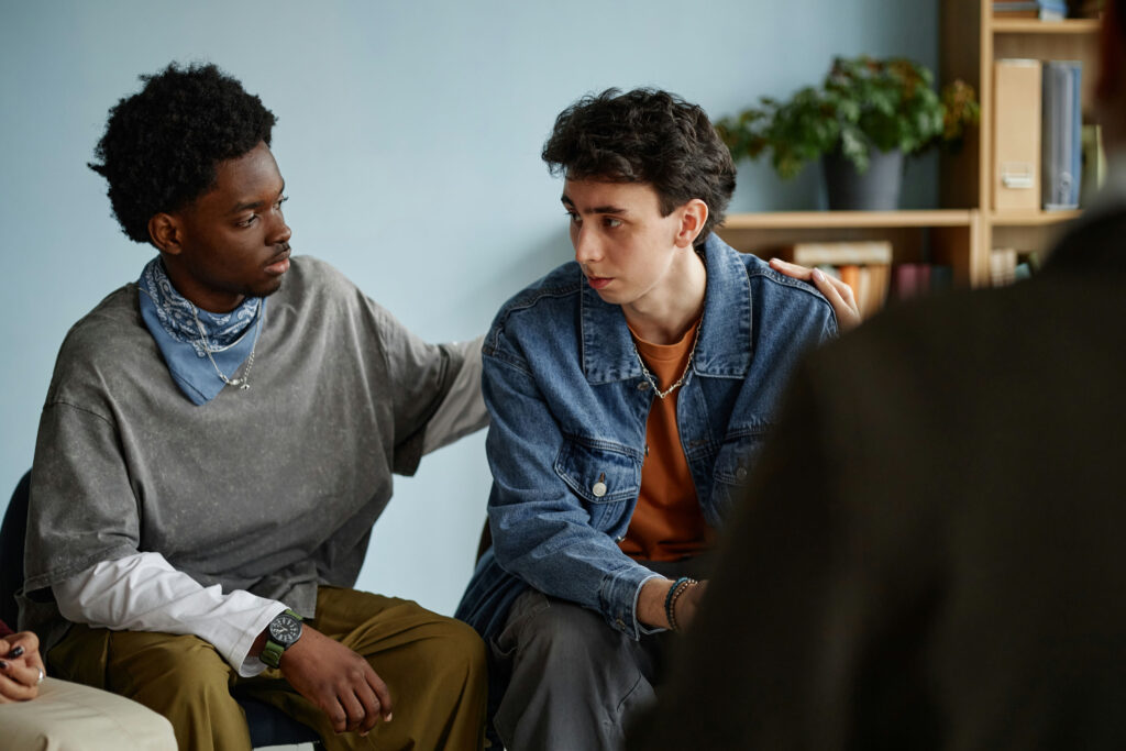 Teens participating in adolescent day treatment program group therapy session