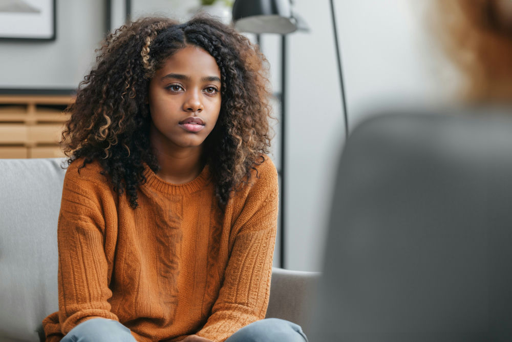 Teen participating in a mental health counseling session with a therapist