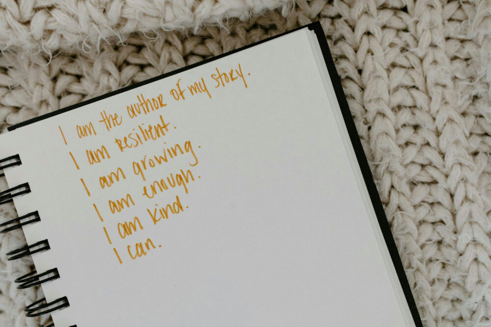 Teen using healthy coping strategies, like journaling, learned through therapy