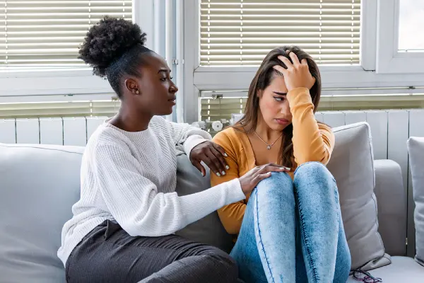Clinician counseling a depressed teenager