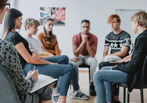 Adolescent psychiatrist consulting with youth